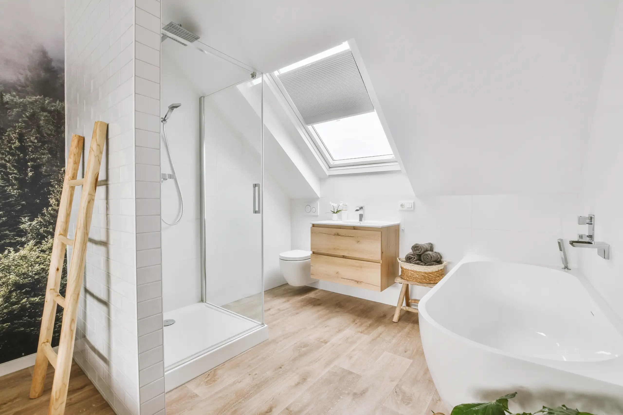 Modern bathroom featuring a glass shower, freestanding tub, and wooden vanity