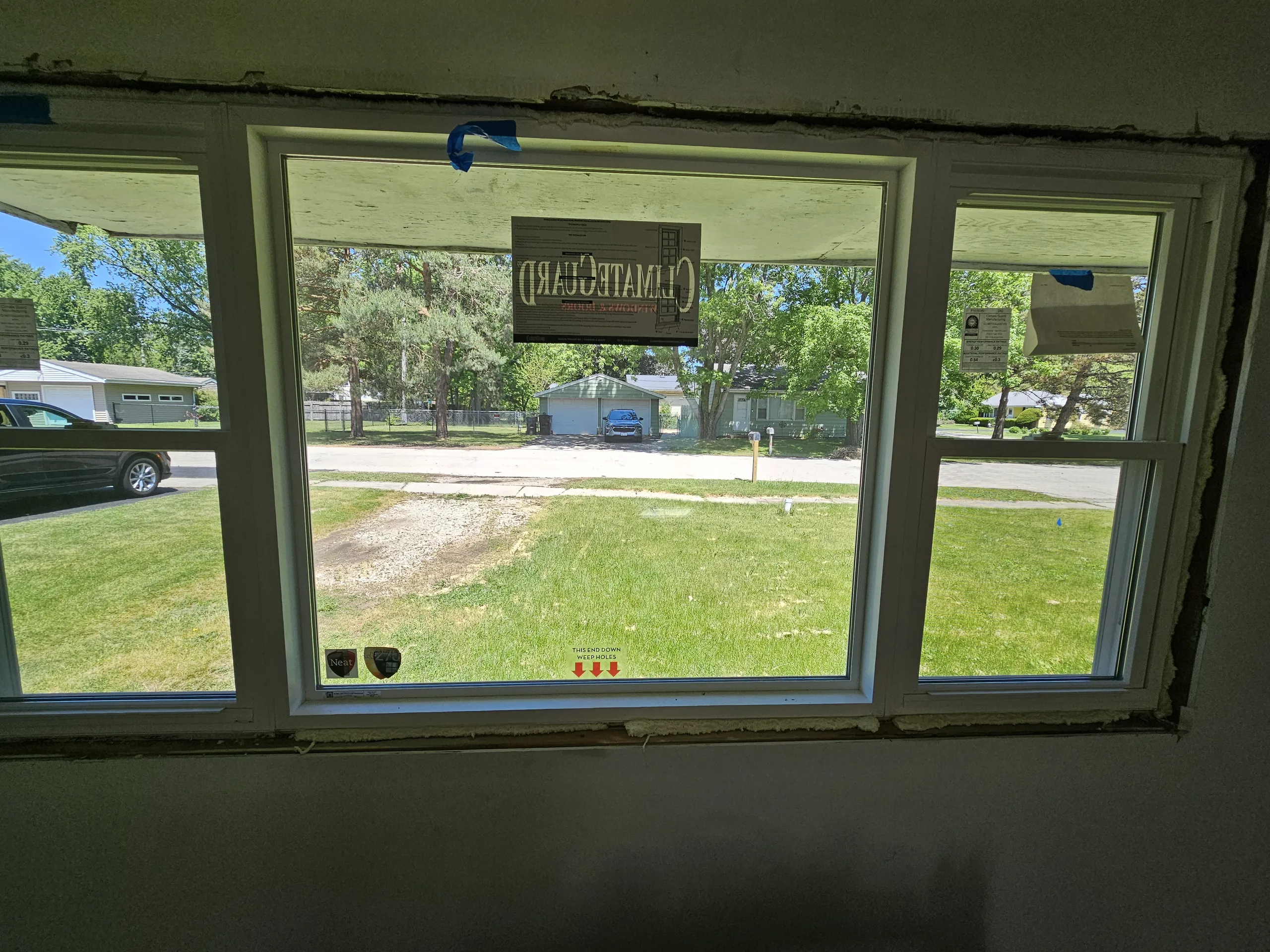 View of a newly installed window with surrounding wall preparation visible